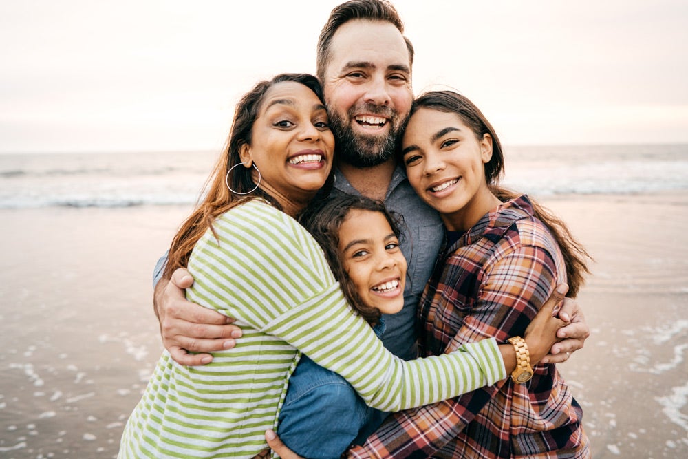 Happy family smiling at the camera
